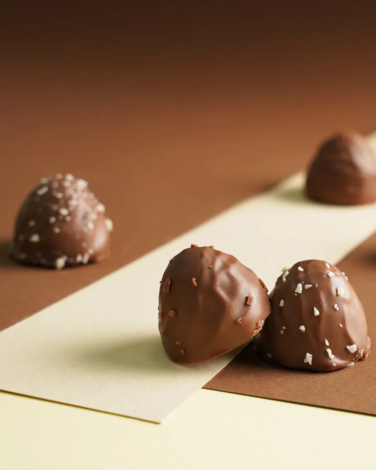 Finished chocolates from our production on presentation paper