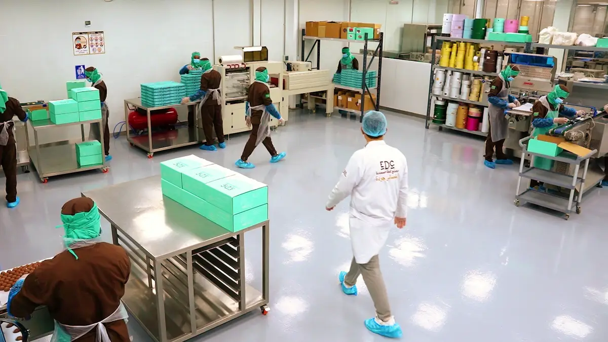 A member of the quality team checking the production lines