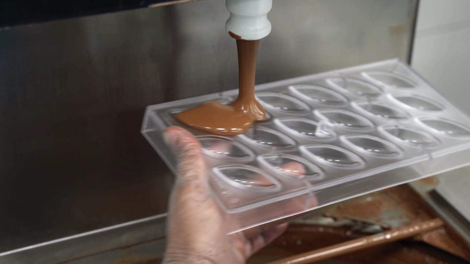 Chocolate poured into a mould at the EDC factory